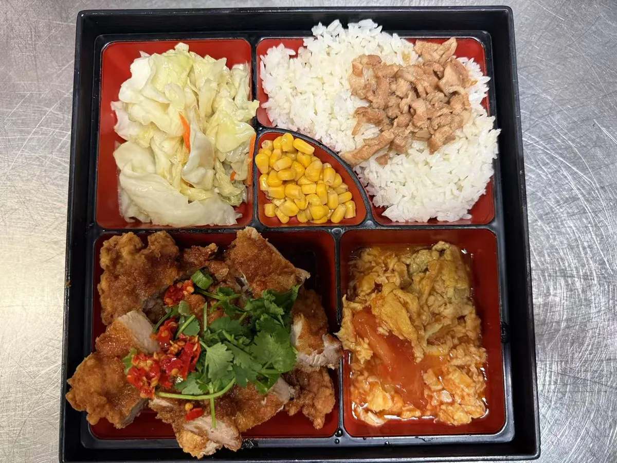 Boxed meal with spicy chicken at Looking for Chai，a Taiwanese Restaurant in Edmonds