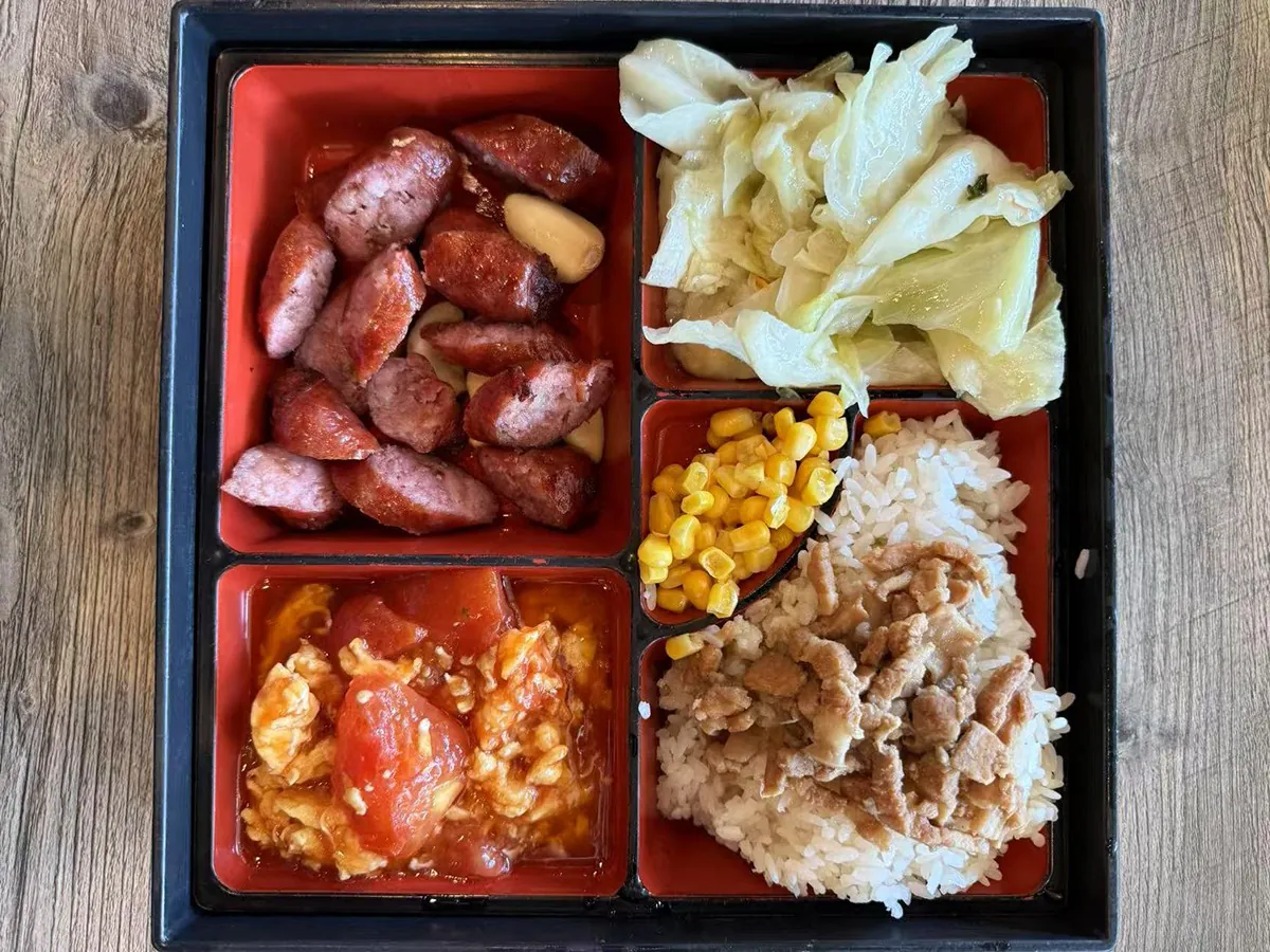 Boxed meal with sausages at Looking for Chai，a Taiwanese Restaurant in Edmonds
